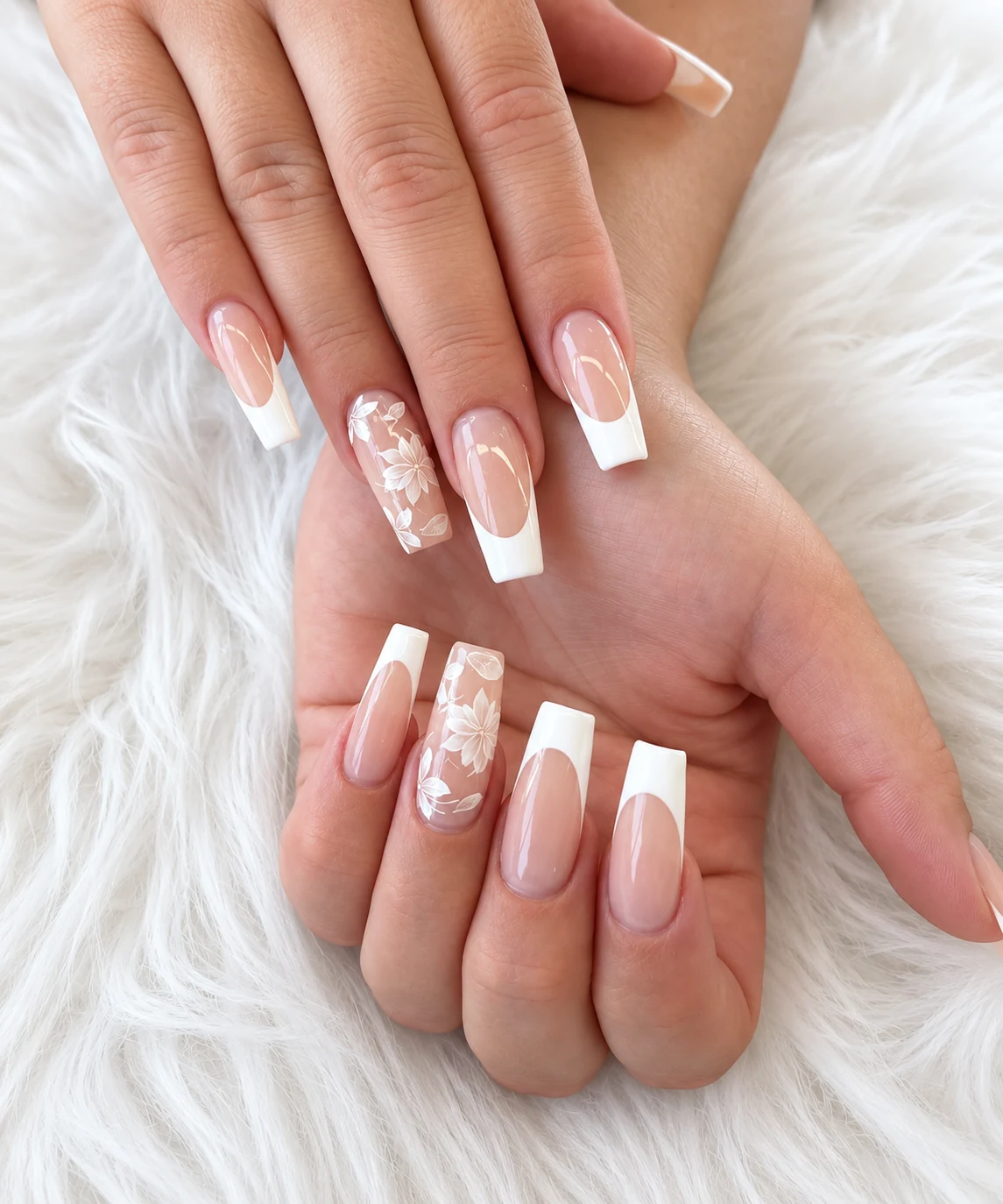 French manicure with floral details created at Serenity Nails & Spa